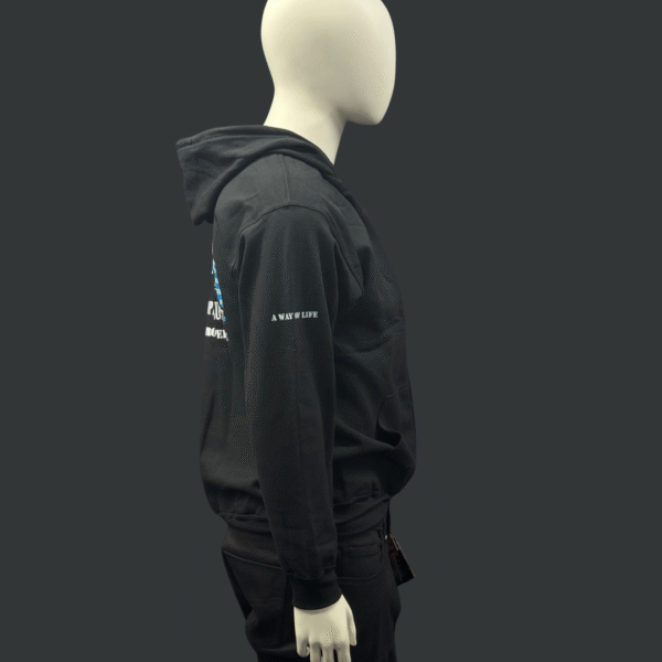 A mannequin in side profile wears a black TROOPER LU'S GARAGE HOODIE - ADULTS and black pants, set against a plain dark background. The hoodie’s sleeve features the text “A NEW LIFE.”.