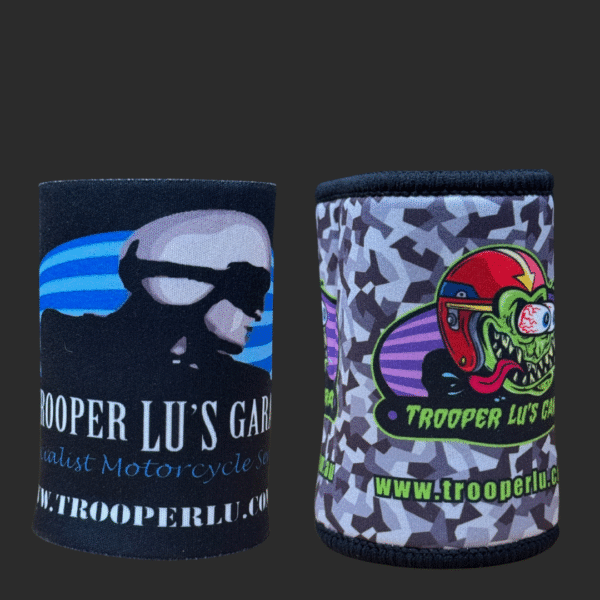 The TROOPER LU'S GARAGE STUBBY COOLER set includes two coolers: one with a stylized helmeted figure and another with a cartoon frog in a red helmet, both featuring the Trooper Lu's Garage website link.