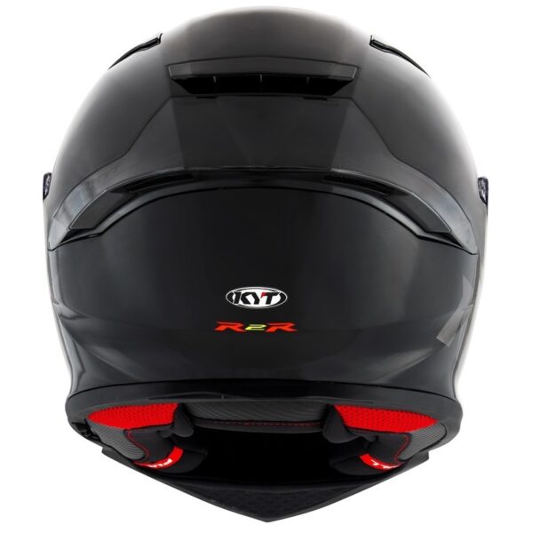 The KYT R2R PLAIN HELMET in matte black features a stylish rear view with red accents and ventilation openings.