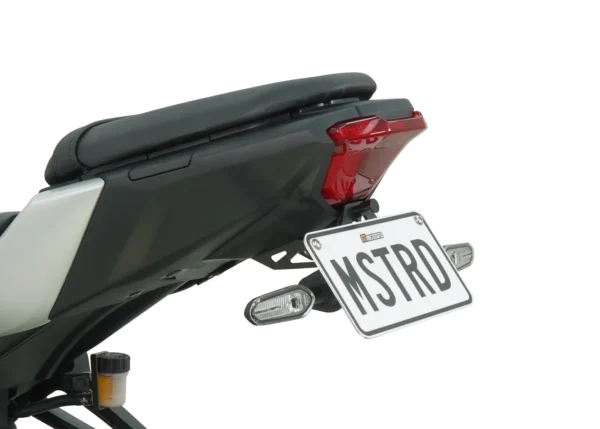 Rear view of the MUSTARD MT-07 2025 TAIL TIDY - 186MM featuring a "MSTRD" license plate, red taillight, and dual side indicator lights.
