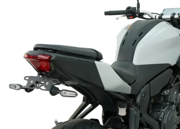 Rear view of a gray and black motorcycle featuring the seat, taillight, and MUSTARD MT-07 2025 TAIL TIDY - 186MM license plate holder.