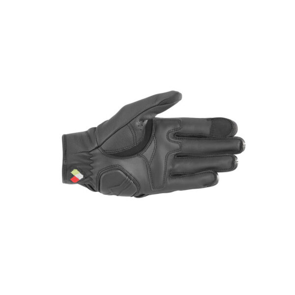 ALPINESTARS DYNO Leather Gloves in black, featuring knuckle reinforcement pads and a Velcro wrist strap, displayed flat on a white background.