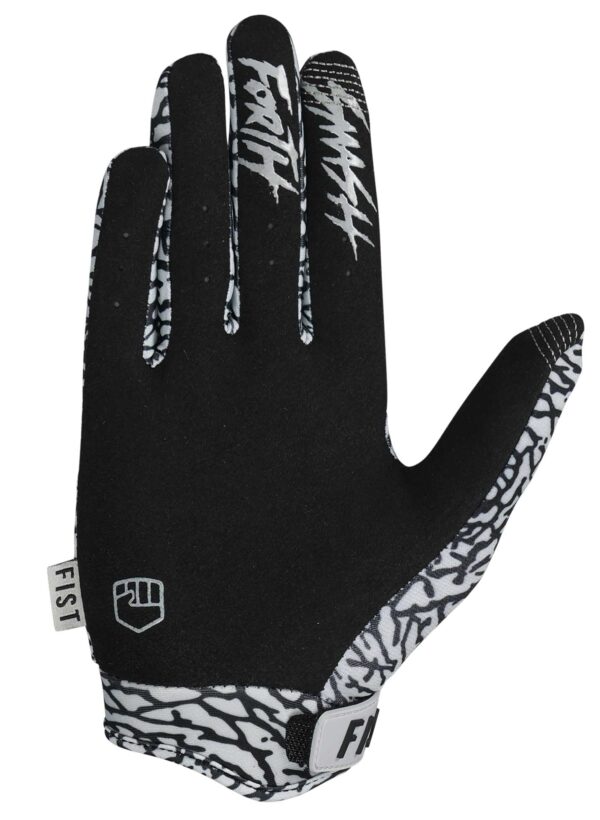 The FIST ELEPHANT GLOVES - LIL FISTS (AGES 2-8) are black and white kids’ gloves featuring "Fist" logos, white graphic patterns on the wrist and fingers, and a velcro strap closure.
