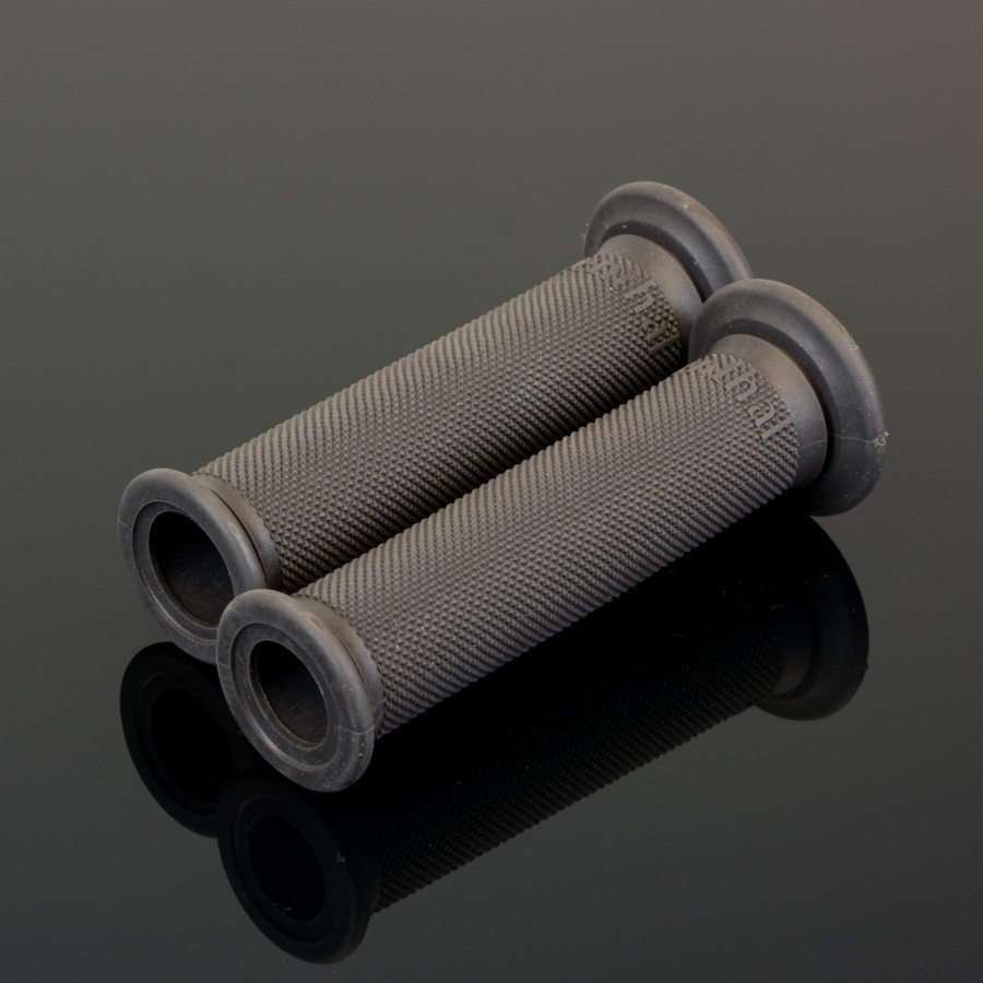 Two RENTHAL ROAD RACE GRIPS FULL DIAMOND - FIRM, featuring a textured black rubber design, are displayed side by side on a reflective black surface.