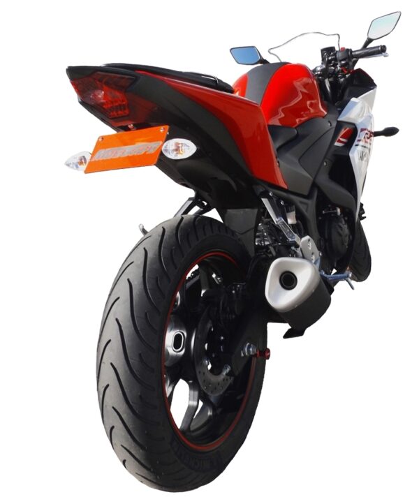 Rear view of a YZF-R3 2019 ONWARDS with the Mustard Tail Tidy (186mm) in red and black, showcasing the rear tire, exhaust, taillight, and part of the license plate.