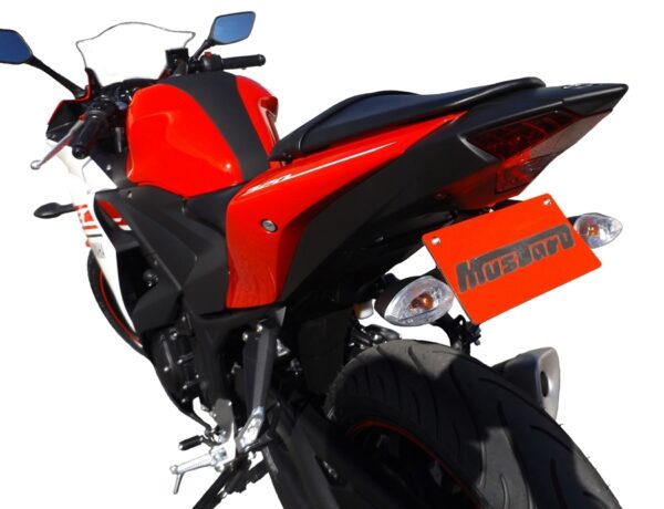 YZF-R3 2019 ONWARDS MUSTARD TAIL TIDY - 186mm shown on a red and black sport motorcycle, photographed from the rear-left to highlight the back tire, tail lights, and orange license plate.