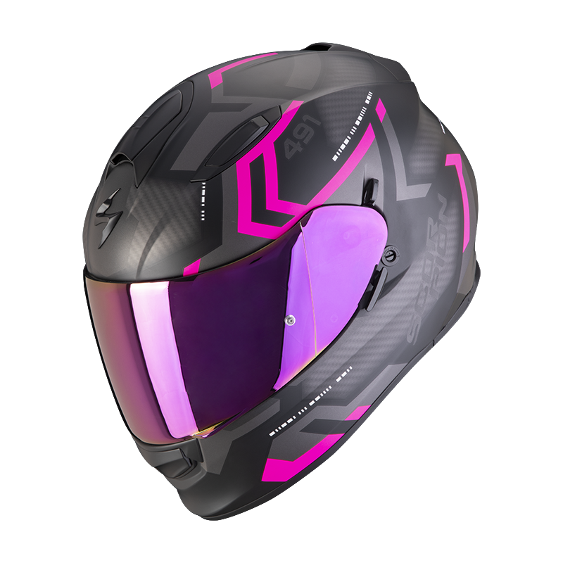 The SCORPION EXO - EXO 491 SPIN HELMET in matte black/pink features pink geometric accents and a reflective purple visor, displayed from a side angle.