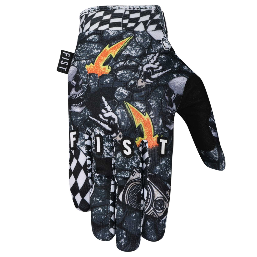 The FIST QUAKER GLOVES - LIL FISTS (AGES 2-8) are black gloves featuring a rock pattern, skulls, lightning bolts, peace signs, checkered design, and "FIST" printed across the fingers.